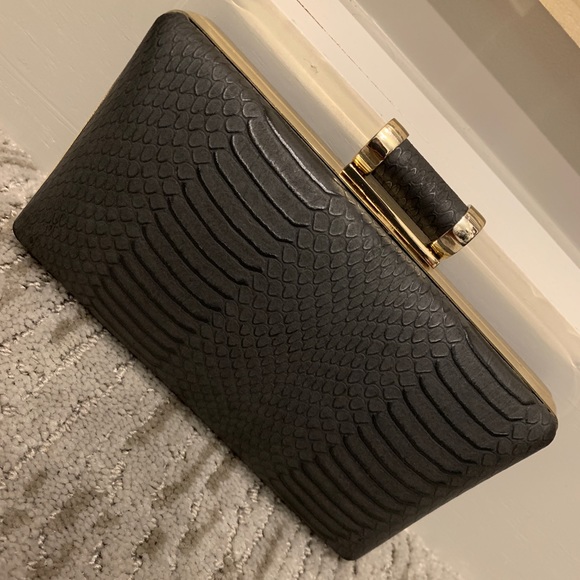 Aldo Handbags - Black and gold Aldo clutch
